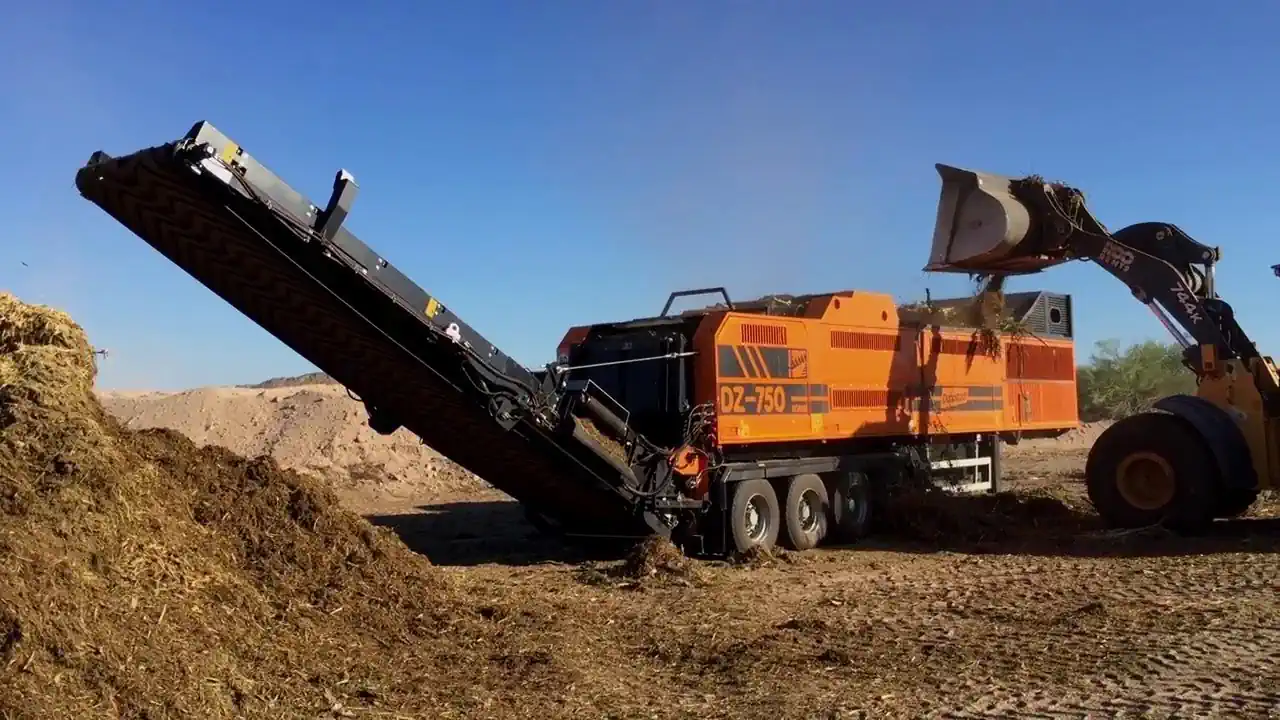 The Doppstadt shredder at work shredding compost. YouTube Thumbnail